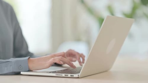 Close Up of Woman Typing on Laptop