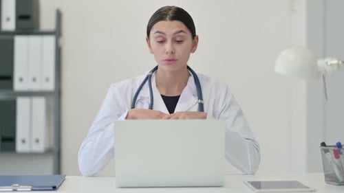 Female Doctor Talking on Video Chat on Laptop