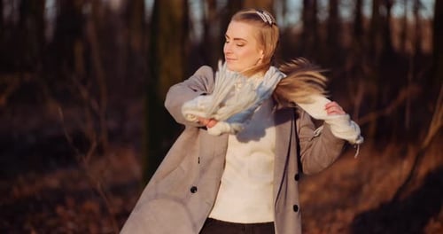 Beautiful Positive Female Wearing Sunglasses in Woods
