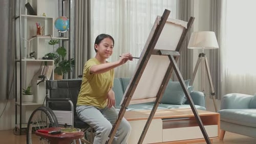 Woman Painting on Canvas in Living Room