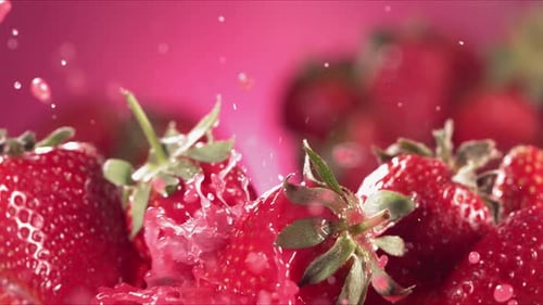 Juicy Strawberries Being Splashed with Fresh Juice