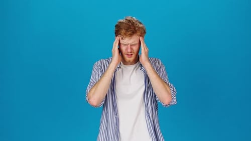 Young Adult Man Experiencing Headache Pain