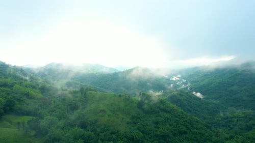 4K Aerial Drone shot flying over beautiful mountain ridge in rural jungle bush forest.