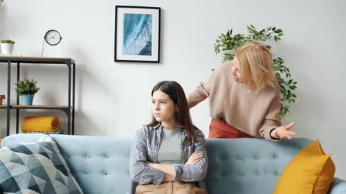 Stubborn Kid Ignoring Angry Mother While Mature Woman Is Yelling and Pushing Child