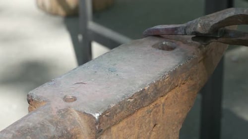 Blacksmith Forges A Metal Part