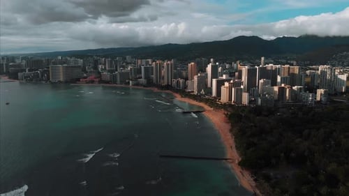 Aerial drone footage of Honolulu, Hawaii.
Beautiful real estate, buildings in the city.
Palm trees