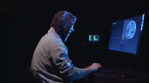 Hooded Hacker Targeted at Computer by Gun