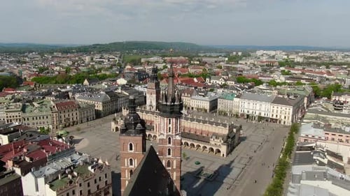 Flying over Main Square, Rynek Glowny in Krakow, Cracow city in Poland, Polska