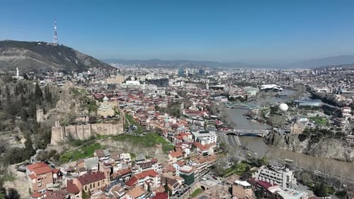 Aerial view of Old Tbilisi in the center of city. Morning cityscape of capital of Georgia 2022
