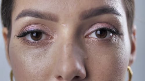 Close Up Of A Woman's Eye With Pink Eyeshadow