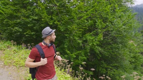 Man Hiking on Forest Mountain Path
