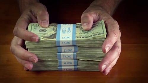 Stack of US Currency Placed on a Table