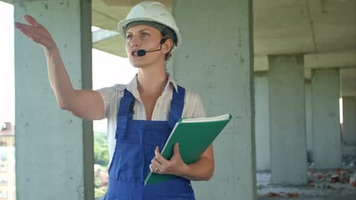 Female Engineer on Construction Site Talking