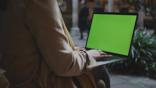 Student Hands Working Laptop with Green Screen. Businesswoman Typing on Laptop