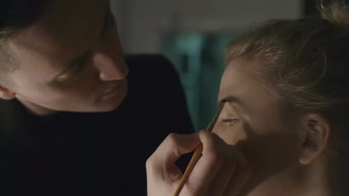 Makeup Artist Filling In Eyebrows