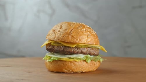Juicy Hamburger Close-up on Wooden Table