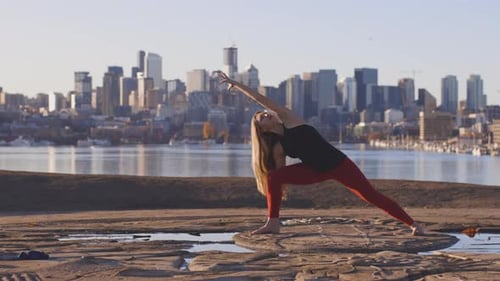 Outdoor Sunrise Woman Practicing Yoga In The City