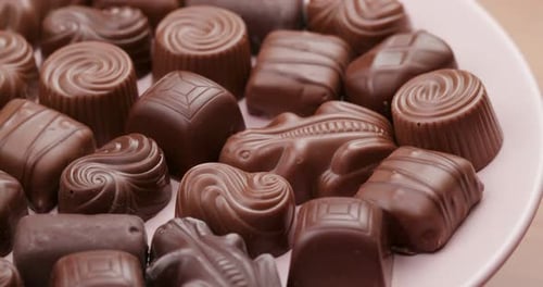 Milk Chocolate Candies on a Pink Plate