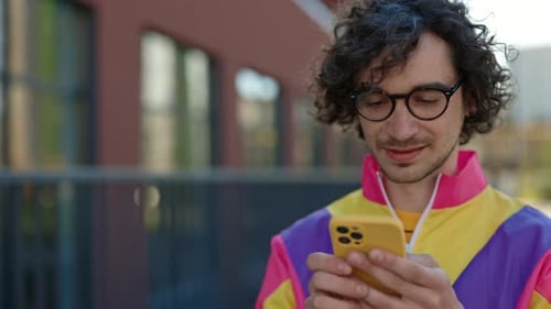 Young Man Using Smartphone in the City