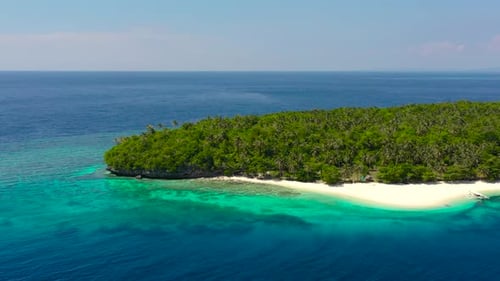 Tropical Island with a White Beach. Mahaba Island, Philippines.