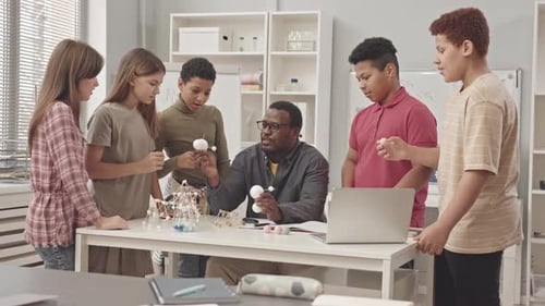 Enthusiastic Students Learn About Molecular Structures in Class