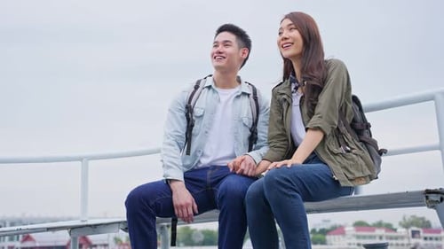 Asian attractive romantic couple travel in the city for honeymoon trip on holiday vacation together.