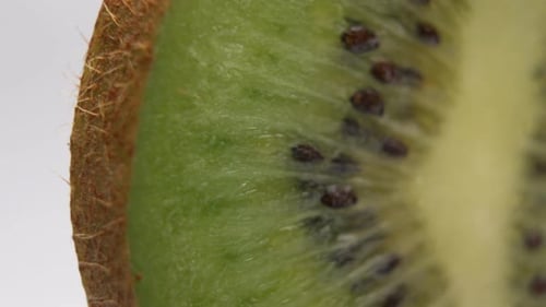 Close-Up Fresh Kiwi Cut Slice Of Fruit On White Background