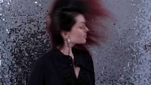 Woman Shakes Head With Long Dark Hair