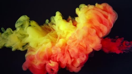 Red and Yellow Acrylic Paint Moving in Water on Black Background