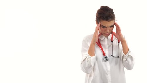 Woman Doctor Massaging Temples With a Headache