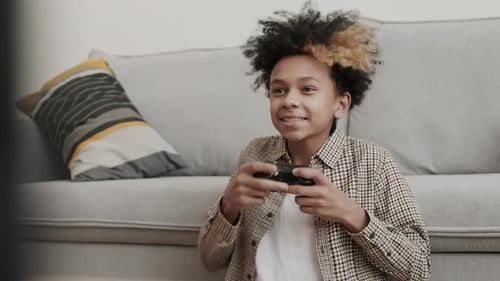 Boy Excited about Winning Video Game