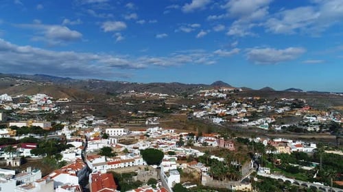 Aerial View of Picturesque Town Nestled Between Hills