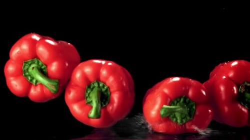 Super Slow Motion Red Bell Pepper Drops Water with Splashes