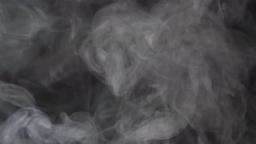Abstract White Smoke Swirling on Black Background