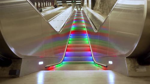 Escalator with Bright Colorful Lights in Subway