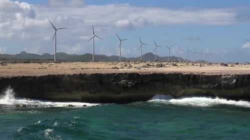 Wind Turbines on Coastal Cliff with Ocean Waves