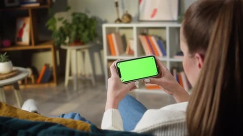 Woman Using Smartphone with Green Screen