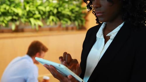 Businesswoman using digital tablet in office