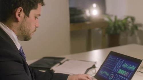 Caucasian Bearded Man Working in Office While Typing on Laptop