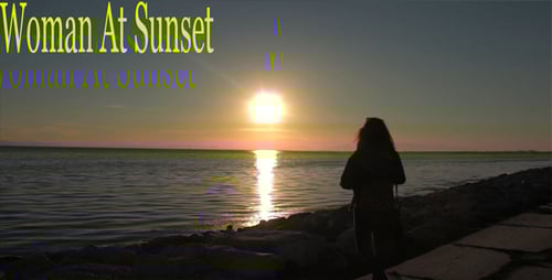 Woman Enjoying Golden Sunset Along the Ocean Shore