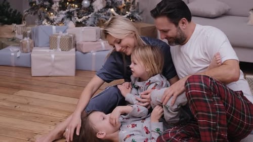 Happy Family Celebrates Christmas at Home