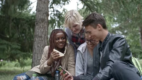Teen Friends Enjoying Picnic in the Forest