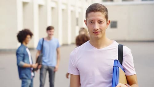 Portrait of student against college building