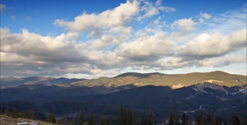 Mountains With Running Clouds