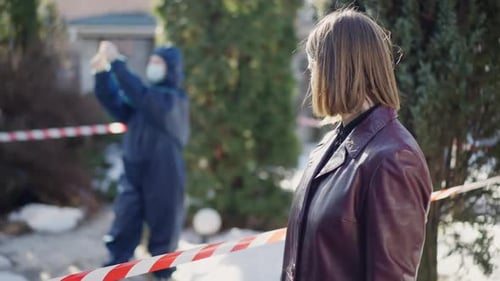 Woman Stands Near Crime Scene