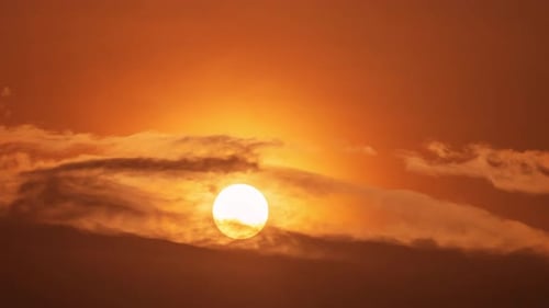 Golden Sunrise Ascending Through Clouds Time Lapse