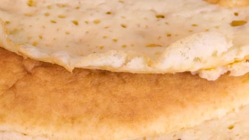 Pile of homemade pancakes, close up view. Extreme detail macro shot in 4k.