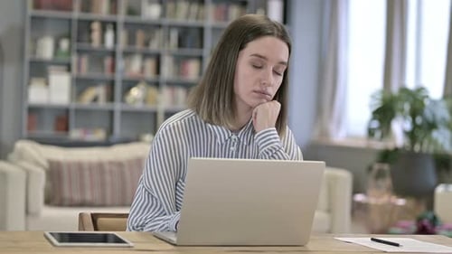Exhausted Young Woman Sleeping in Loft Office