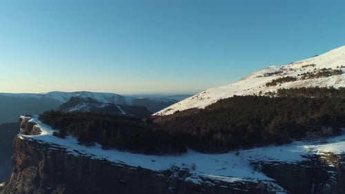 Snowy Mountains and Clear Sky Aerial View
