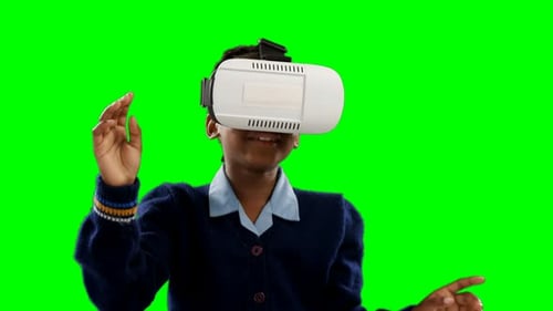 Child Using Virtual Reality Headset on Green Screen